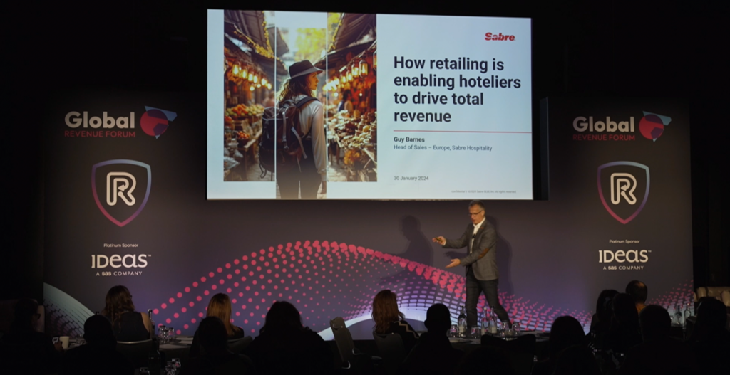A picture of Guy Barnes on stage at the GRF conference